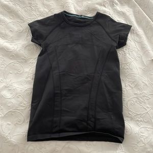 Black Ivivva short sleeve top. Tag removed. Size 10.
